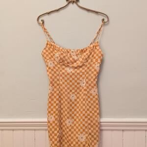 Orange and cream checkered floral mini dress.